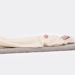 Nomad Heat Camping mattress, camping pad in use by model - full lenght